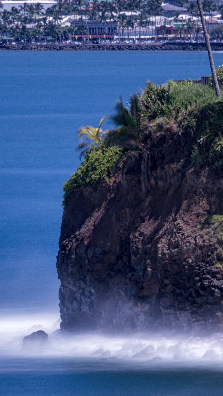 Long exposure of outcropping near Honolii with Hilo Town in the background