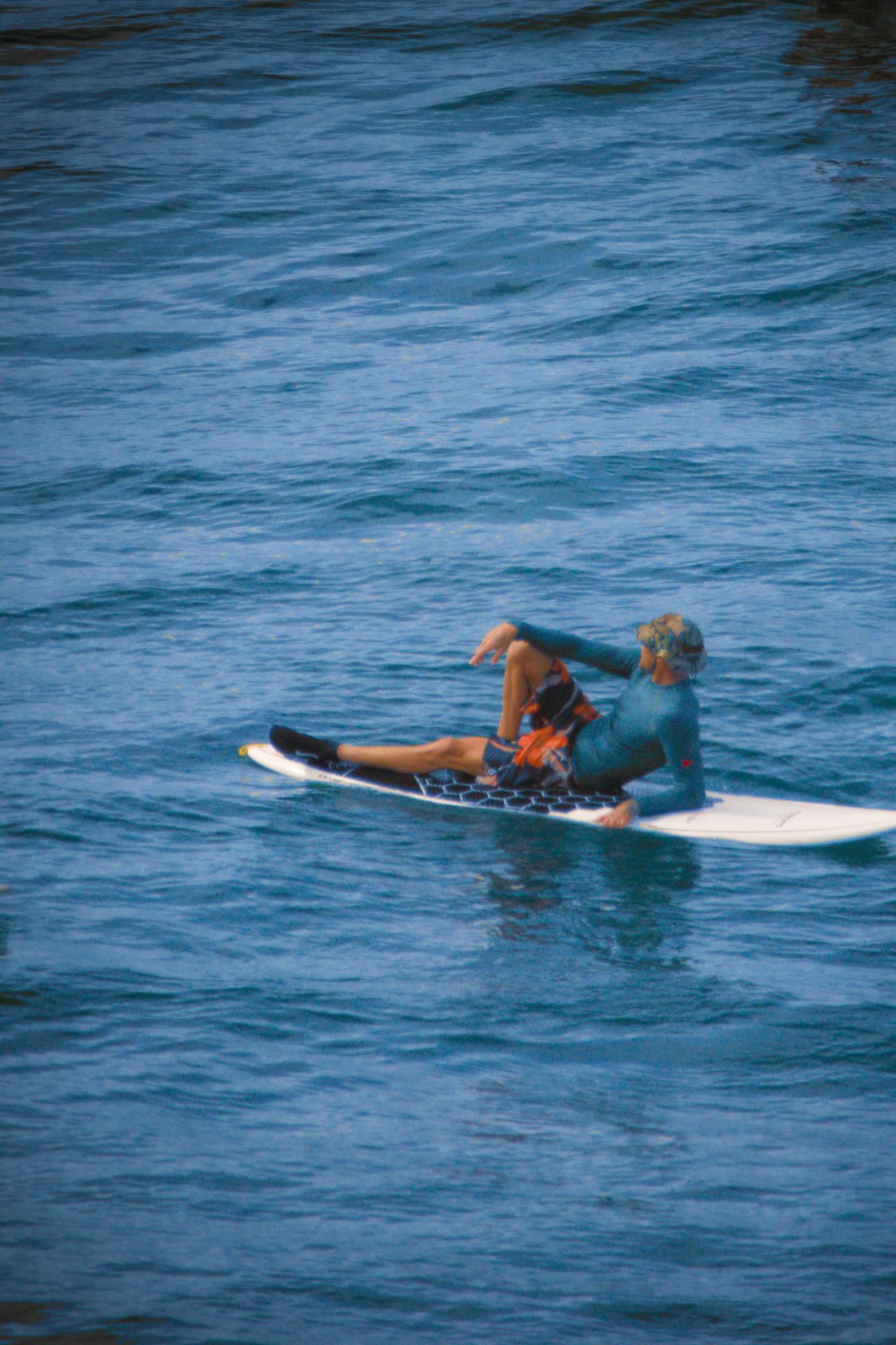 Resting on surfboard