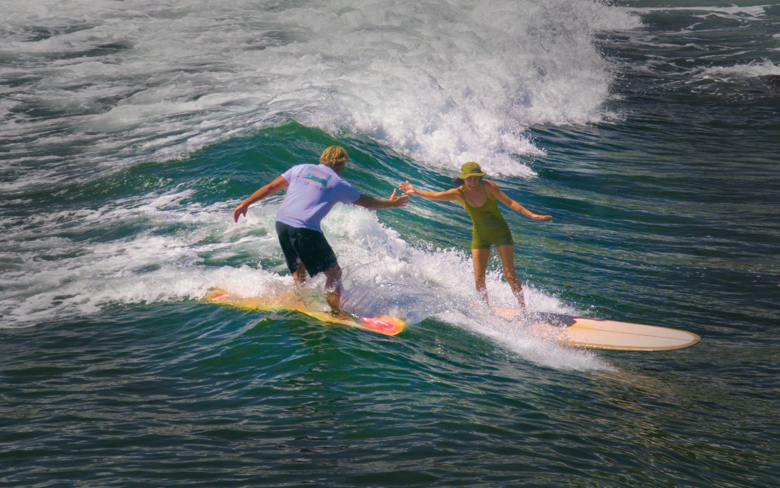 Surfers clapse hands