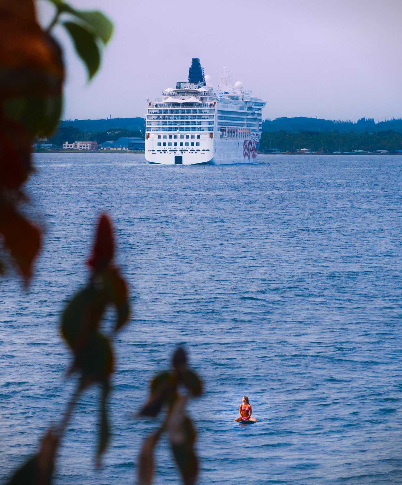 Pride of America and a surfer